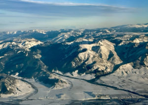 Landscape image taken from airplane, snowy peaks